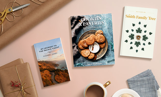 Published titles styled on a desk: My Journey to the Pacific Coast, Cookies & Pastries, and the Smith Family Tree